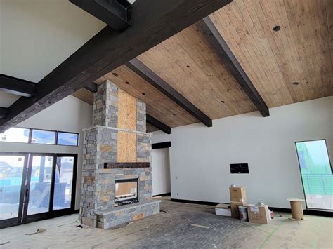 custom-home-builder-tongue-and-groove-ceiling-beams-progress-fireplace - HighCraft