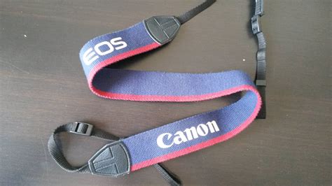 Which camera model/generation does this Canon EOS strap belong to? - Photography Stack Exchange