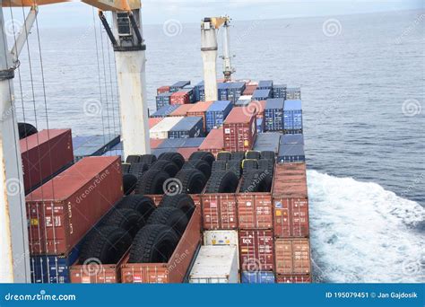 Merchant Cargo Container Vessel with Cranes Underway through Calm Atlantic Ocean Under Overcast ...