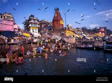 Pilgrims bathing in the Dashashwamedh Ghat of Ganges, Ganga River in ...