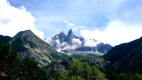 Jagged Mountain Peaks Covered in Snow and Hidden in Mist and Fog Stock ...