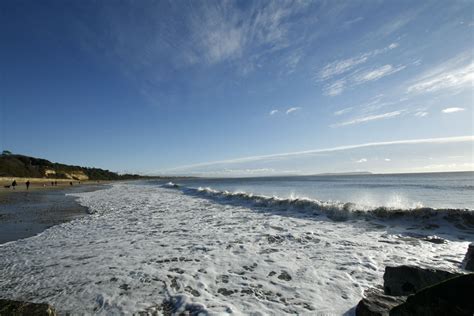 the beach is covered in white foam and waves