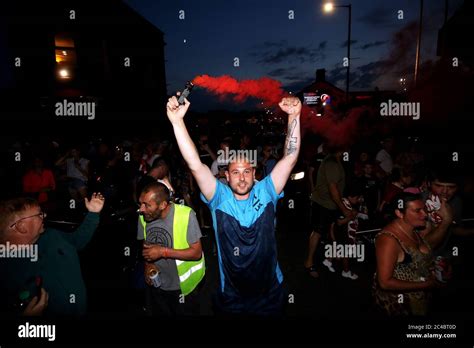 Liverpool fans celebrate outside Anfield, Liverpool Stock Photo - Alamy