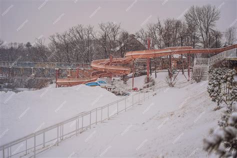 Premium Photo | Summer water park in winter under the snow