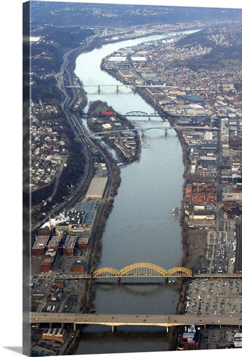 Aerial shot of bridges over a river in Pittsburgh, Pennsylvania Wall ...