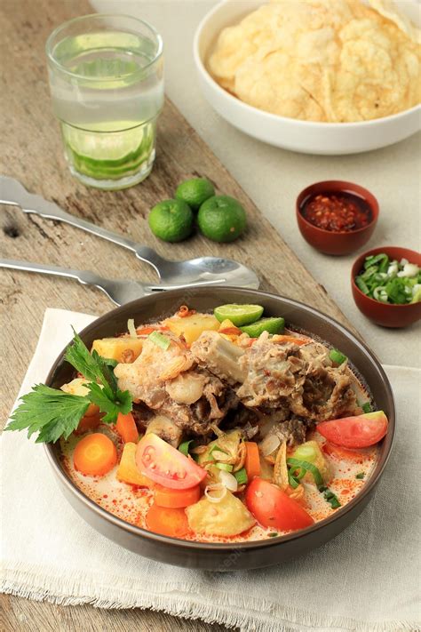 Premium Photo | Soto tangkar traditional beef ribs cooked in coconut milk soup