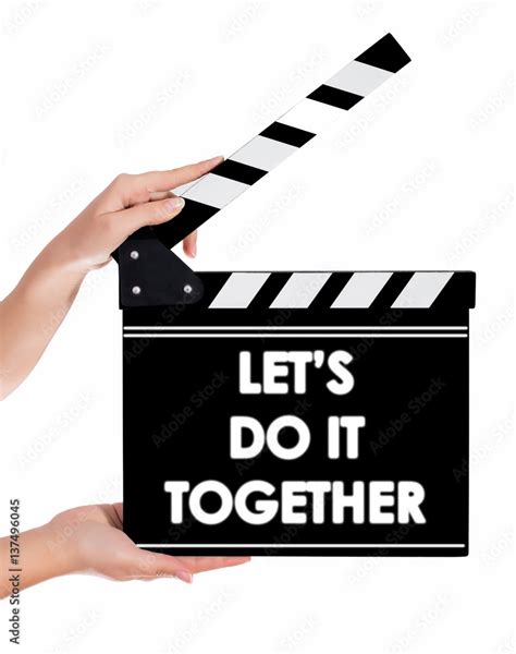 Hands holding a clapper board with LET'S DO IT TOGETHER text Stock ...