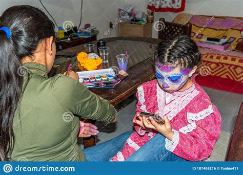 Young Woman Putting Makeup of Catrina in a Girl`s Face Stock Photo ...