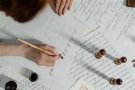 Close-Up Shot of a Person Writing on a Paper · Free Stock Photo