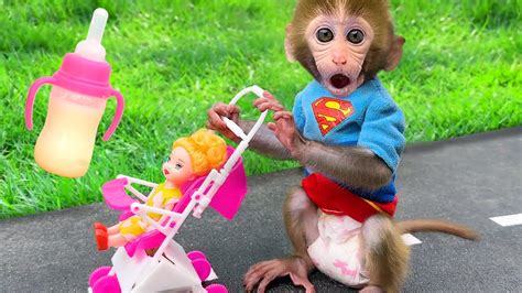 Monkey Baby Bon Bon feeds baby with a bottle and plays with ducklings in the pool - YouTube