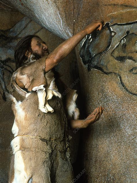 Model of a Cro-Magnon man doing a cave painting - Stock Image - E448/0049 - Science Photo Library