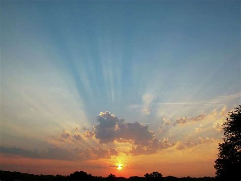 Smoke and dust create crepuscular rays