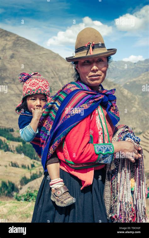 Cusco / Peru - May 29.2008: Portrait of the young peruvian woman in the mountains dressed up in ...