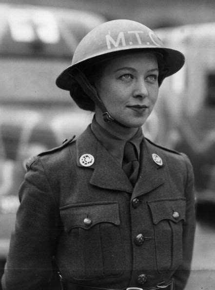 A woman ambulance driver of the British Women's Auxiliary Army, Motor... | Wwii women, Military ...