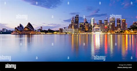 Sydney skyline and reflection during sunrise, New South Wales Australia ...