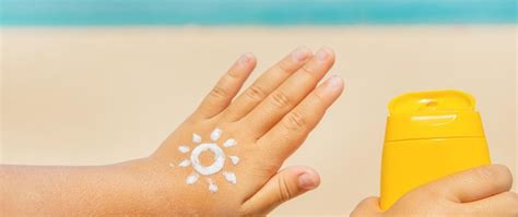 Premium Photo | Close-up of woman holding hands at beach