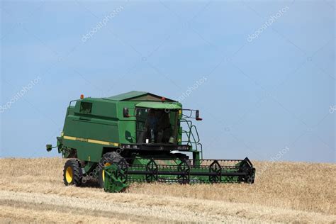 Machine harvesting the corn field – Stock Editorial Photo © philipus ...