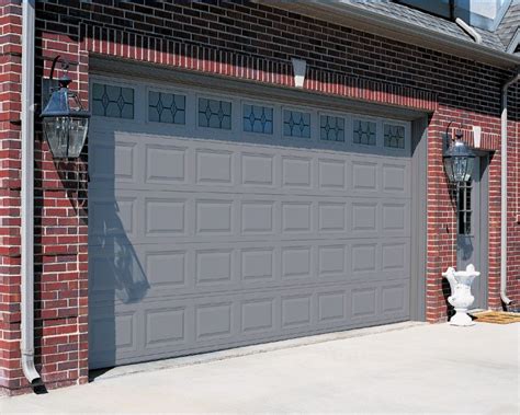 brick homes with bronze garage doors - Google Search em 2021