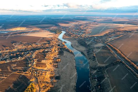 Premium Photo | Aerial view of the river stretching into the distance blue winding river