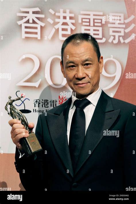 Chinese actor Wang Xueqi poses with his best actor award for his role in " Bodyguards and ...