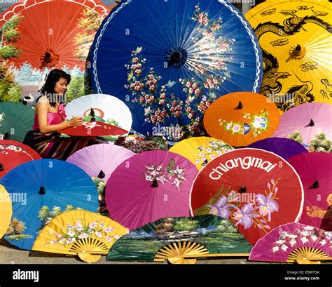 Parasol painting, young woman painting silk parasols, Bo Sang, Chiang Mai, Northern Thailand ...