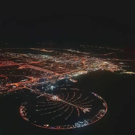 an aerial view of the city lights at night