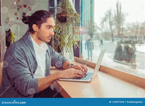 Man typing at laptop stock photo. Image of blouse, gray - 143297244