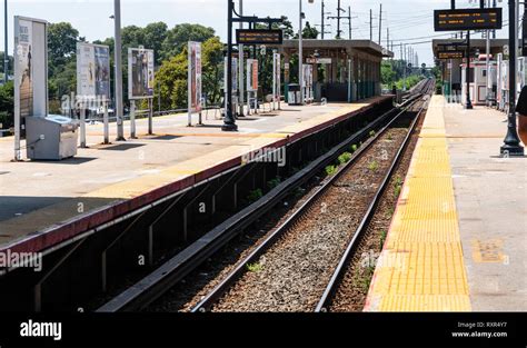 Babylon, New York, USA - 14 August 2018: Looking down the tracks on the ...