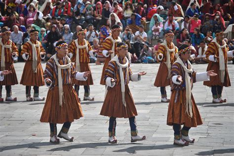 Traditional dancer performing the dance during the annual Thimphu Tshechu | Fashion, Thimphu, Coat