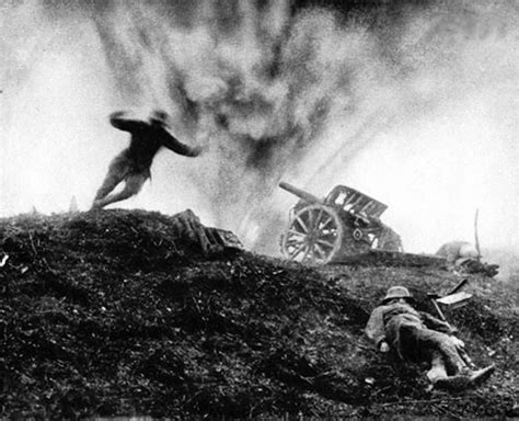 German soldier dives for cover as shell explodes behind him at an artillery position, 1917 ...