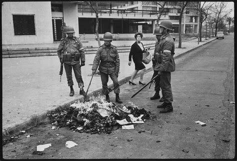 September 1973: Soldiers burn left-wing literature and other subversive ...