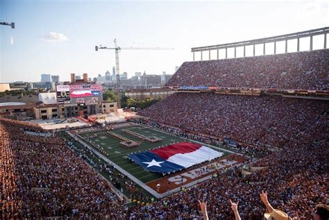 UT-Austin preparing to let football fans fill half its stadium when ...