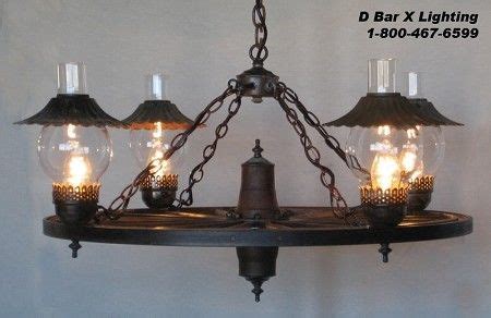 Rustic Wagon Wheel Chandeliers s by D Bar X Lighting | Rustic lighting, Wagon wheel chandelier ...