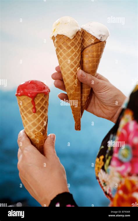 Woman holding ice cream, close-up Stock Photo - Alamy