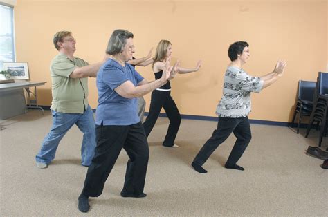 A community group practices Tai Chi, a mind-body practice that originated in China as a martial ...