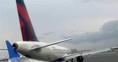 Love tap on the tarmac: Video shows Delta and United planes in slow ...