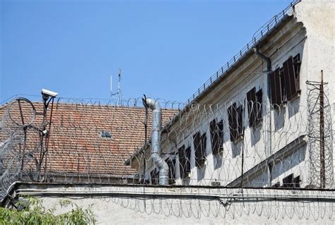 Barbed Wire Fence of the Prison Stock Image - Image of padlock, fence ...