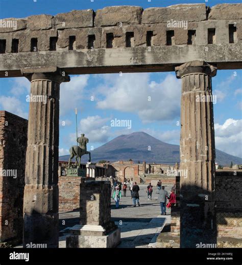 Mount vesuvius looms over the archaeological park / town of Pompeii, a ...