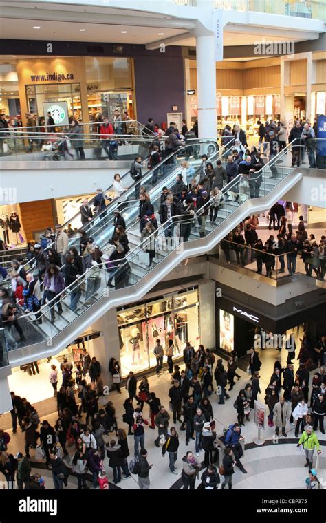 busy crowd inside shopping mall multi level Stock Photo - Alamy