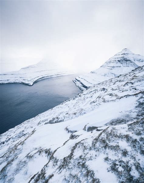 German photographer captures rare photographs of snow covered Faroe Islands - RumbleRum