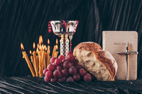 Chalice, Holy Bible, Christian Cross, Candles and Food Stock Photo ...