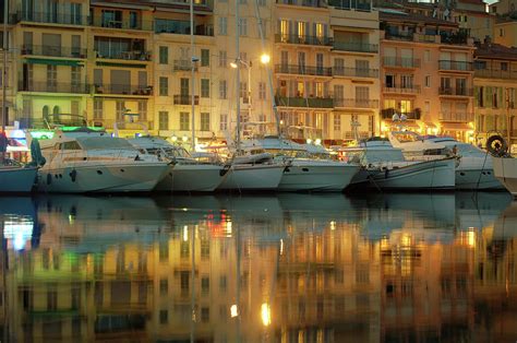 Boats In The Harbor Of Cannes At Night by Nikitje