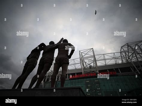 The United Trinity statue outside Old Trafford Stock Photo - Alamy