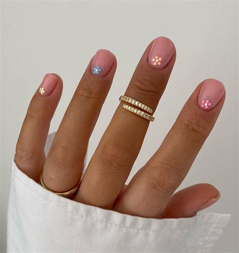 We can’t log in to our social media without seeing this cute trend all over our feed—daisy nails ...