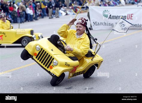 Ray the Moolah Shriner salutes as he puts his car up on two wheels ...