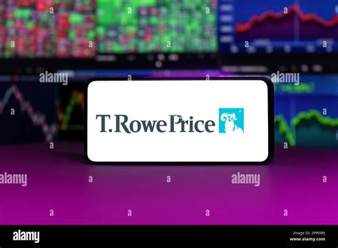 T. Rowe Price on stock market index in front of stock market charts ...