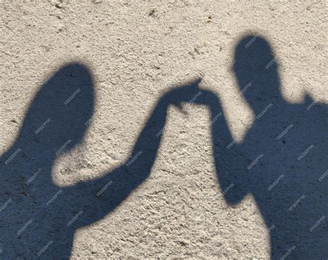 Premium AI Image | Close up of shadow of people holding hands created ...