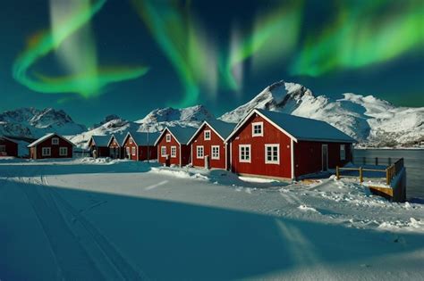 Premium Photo | Astonishing winter scenery with traditional norwegian red wooden houses on the ...