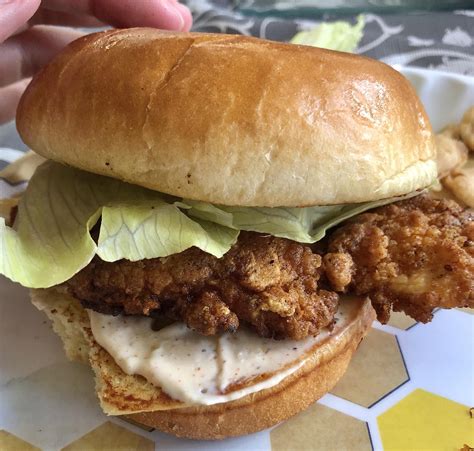 Homemade spicy fried chicken sandwich! Featuring my fingers lovingly caressing the brioche bun.