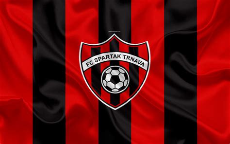 a soccer ball is on the black and red striped fabric